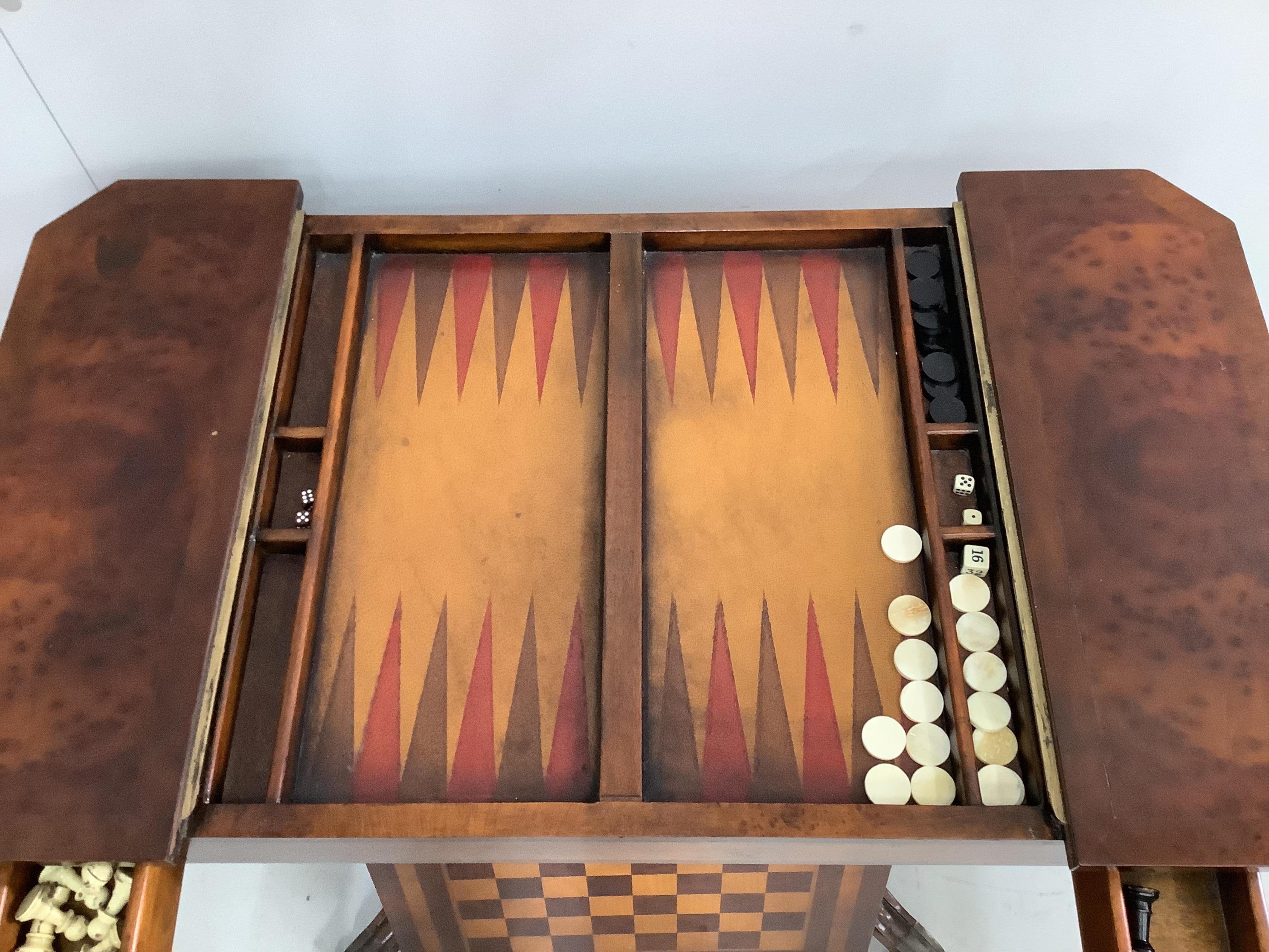 A reproduction bird's eye maple games table, with chess and backgammon surfaces, width 89cm, depth 50cm, height 76cm. Condition - fair